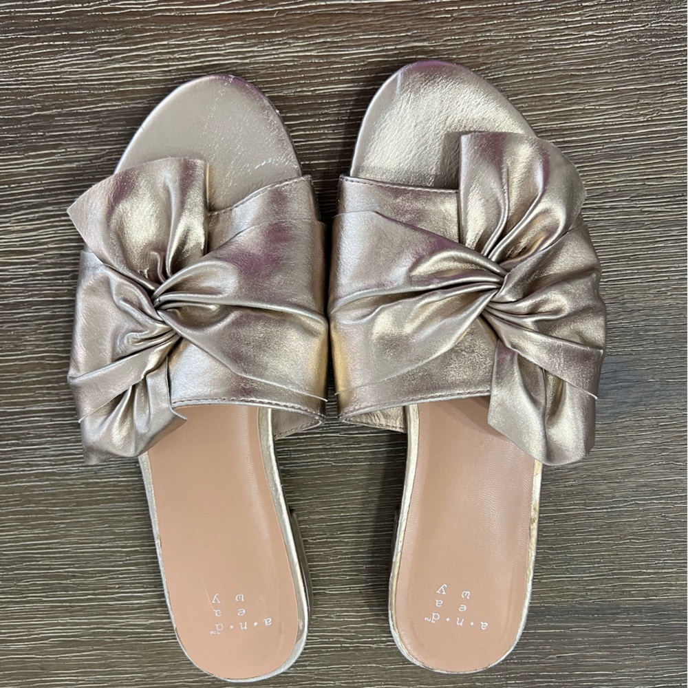 Gold worn bow sandals
